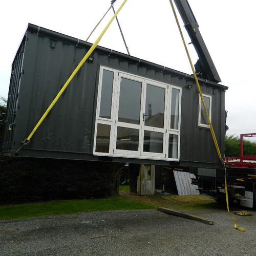 Workers accommodation container house getting lifted into place