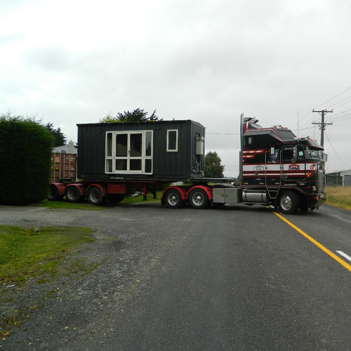 Workers shipping container accommodation on the move